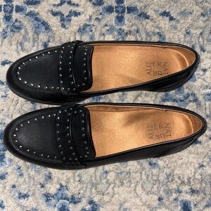 Black flats with stud detail